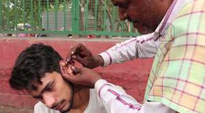 Ear Waxing - Traditional ear cleaner in India
