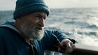 us_wm_veo_3_a-medium-shot-frames-an-old-sailor-his-knitted-blue-sailor-hat_LLpQrIw